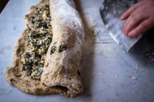 rolling the dough around the filling